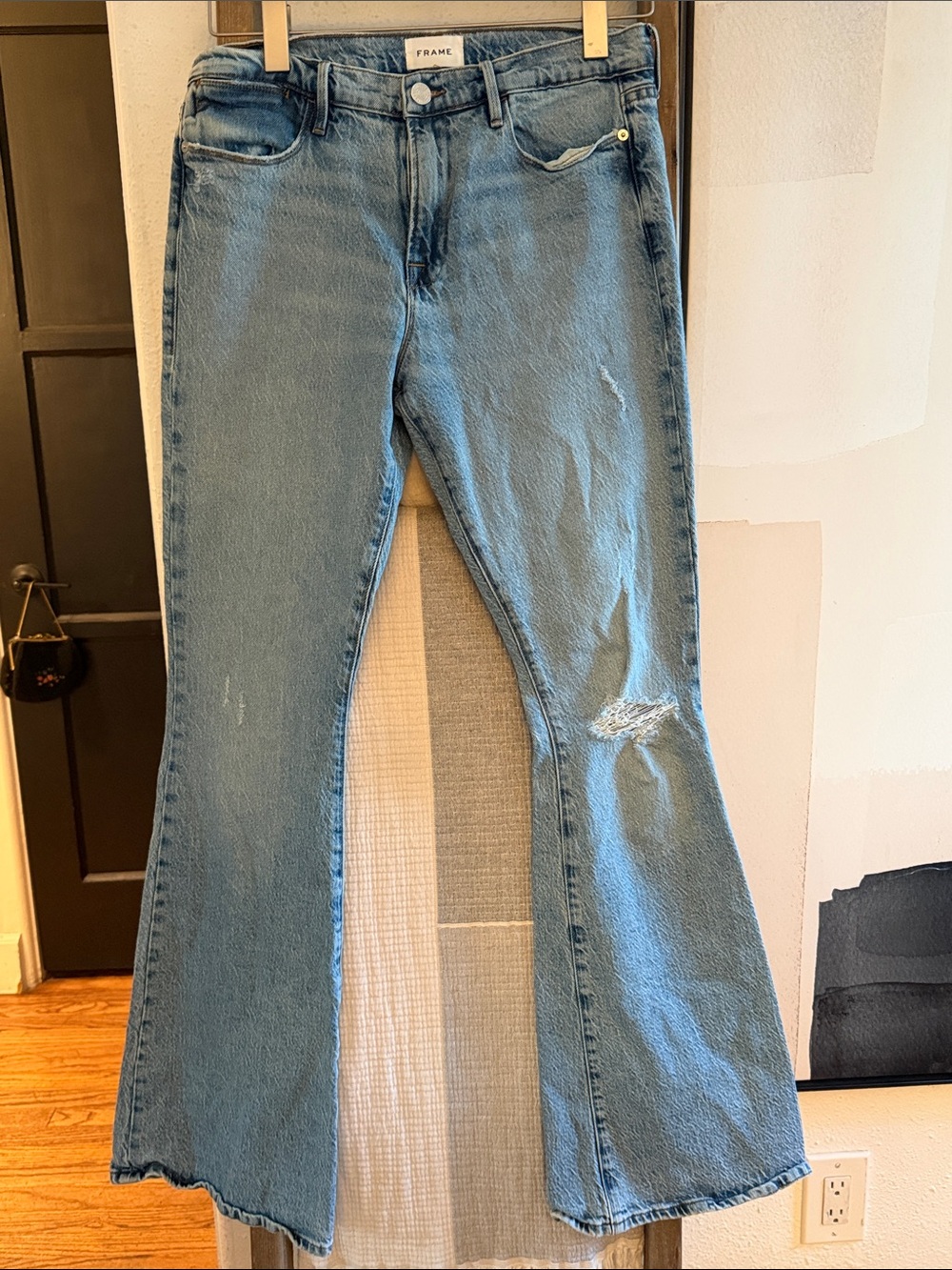 Frame Denim Light Blue Flare Jeans with Distressed Knee